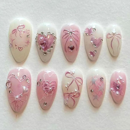 24Pcs Pink Bow Press on Nails Medium Almond Fake Nails with Silver Heart Rhinestones Design Glitter False Nails White Full Cover Artificial Glue on Nails Handmade Stick on Nails for Women Acrylic Nail